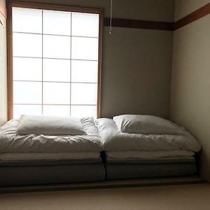 Kamer met Twee Aparte Bedden in Japanse Stijl